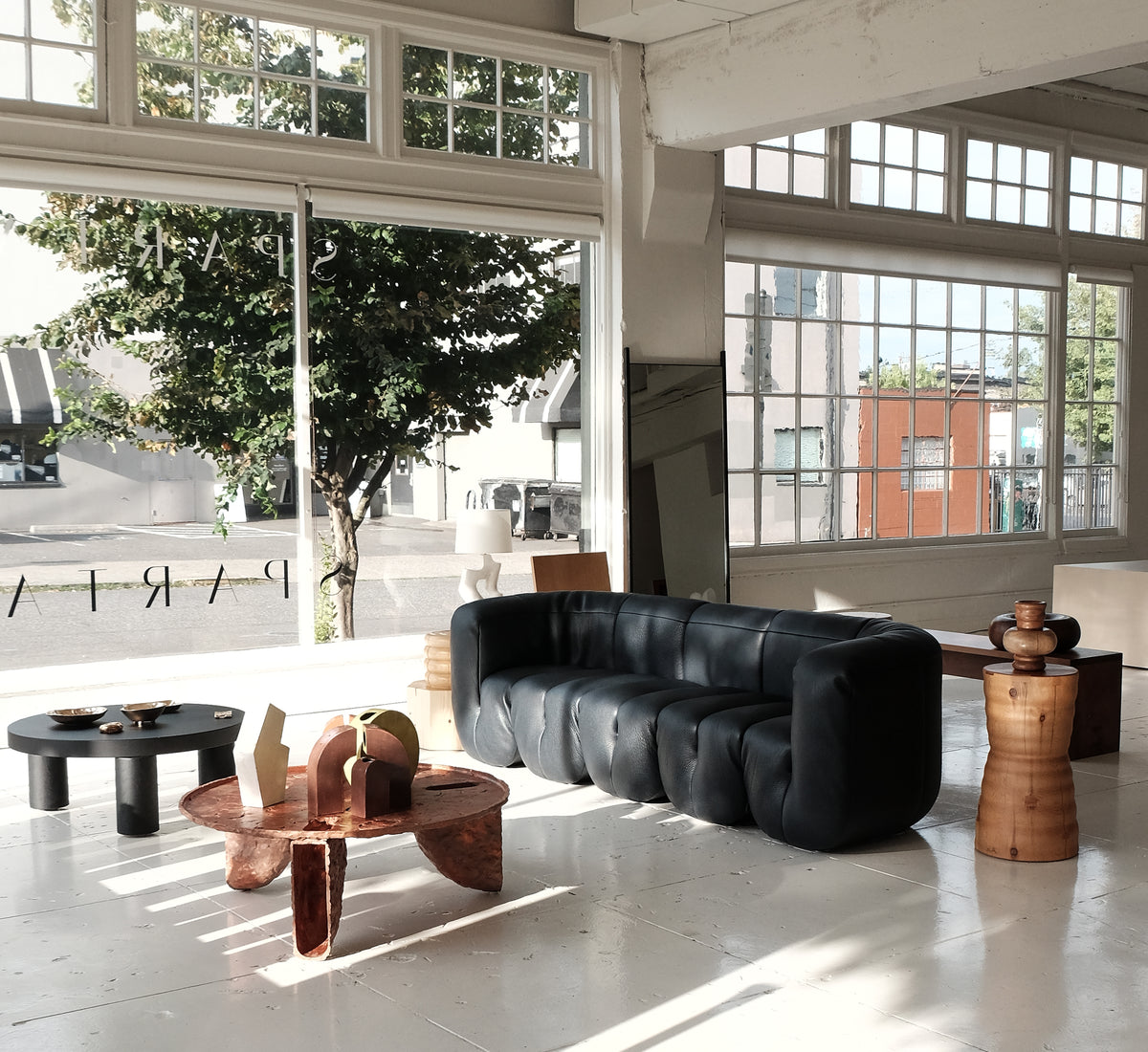 Sculptural furniture in a sunlit showroom